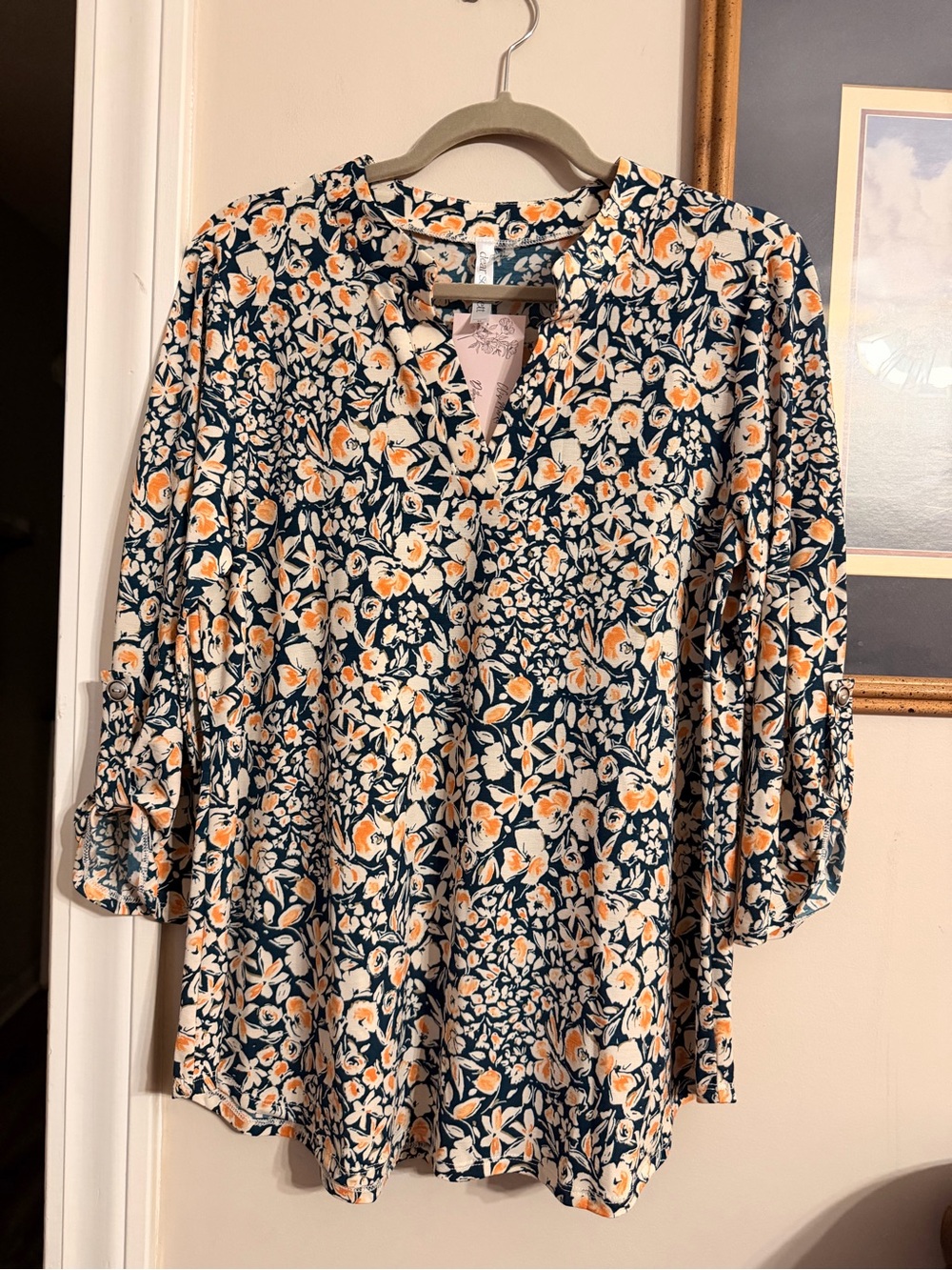 Dear Scarlett Women's Navy Floral Split-Neck Blouse with Orange Accents